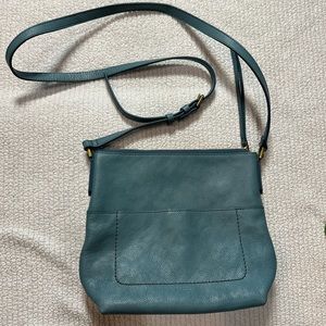 Fossil leather bag, icy teal/blue. Adjustable shoulder strap.